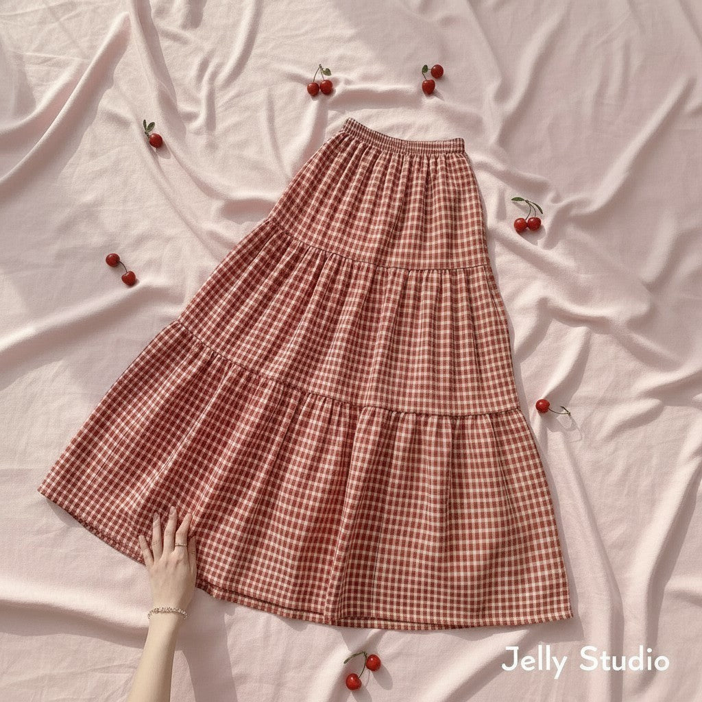 Jelly Studio red and white gingham tiered midi skirt with a high waist. Made of polyester blend.