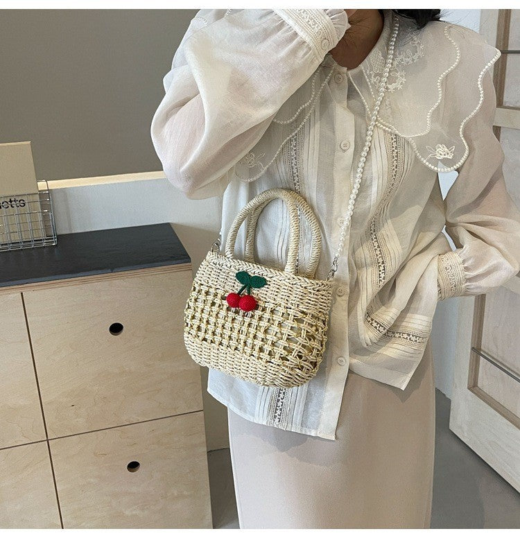 Jelly Studio straw picnic basket with cherry embellishment and pearl strap